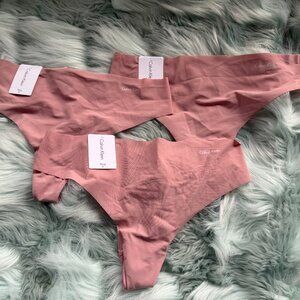 THREE (3) Calvin Klein Women's Invisibles Thong Panty Medium RED Grape NWT